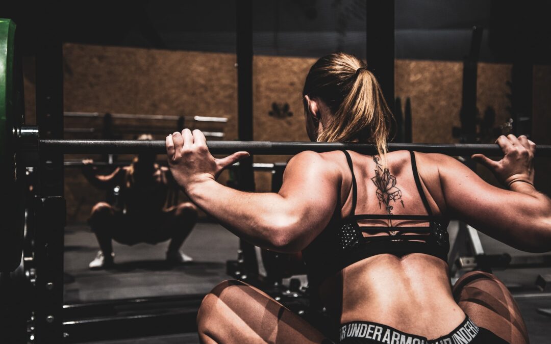 women squatting a barbell